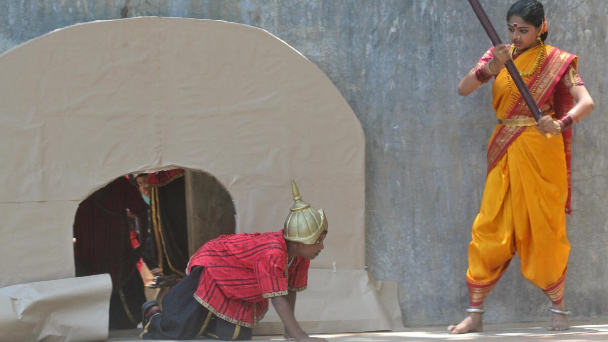 A girl playing Onake Obavva during a play. (Source: The Hindu)